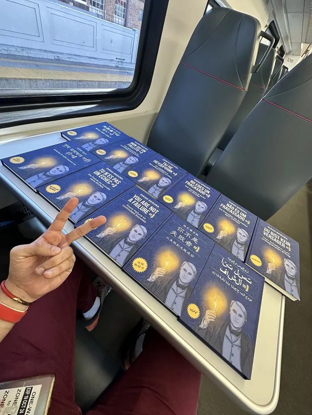 Diego Segura. With his books on the train in Palo Alto.
